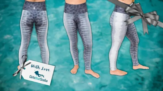 Collage of Waterlust's tiger shark print leggings on a blue water background with a Girls that Scuba gift tag