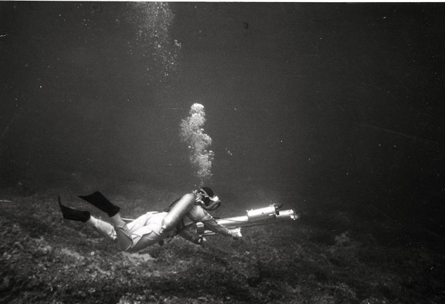 Black and white image of Honor Frost scuba diving for underwater archaeology 
