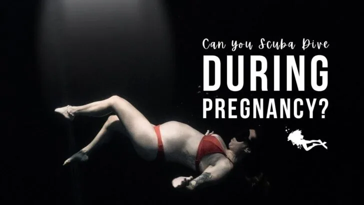 Pregnant woman freedives in dark, black water. Wearing a red bikini, she faces up to the surface and holds her arms out with her legs angled slightly. Overlaid white text reads 
