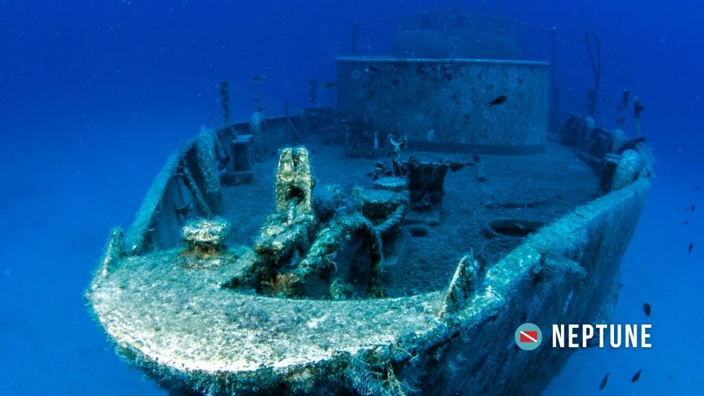 A shipwreck sits in deep blue water in Kas, Turkey, at Neptune dive site. 
