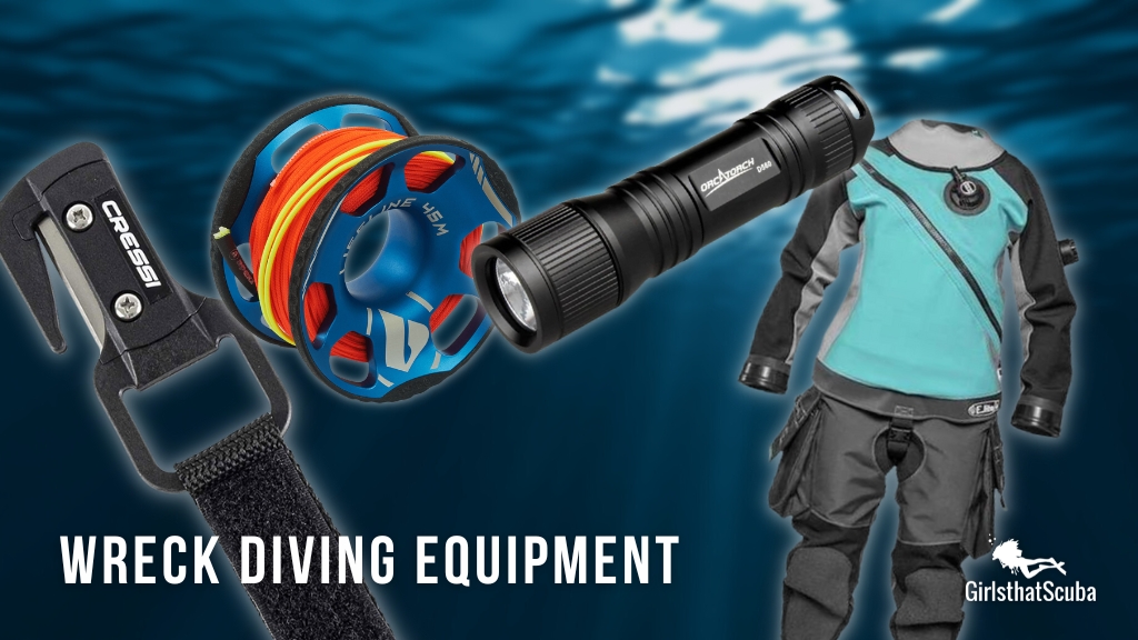 Scuba diving equipment items lay over a blurred dark blue ocean background. 